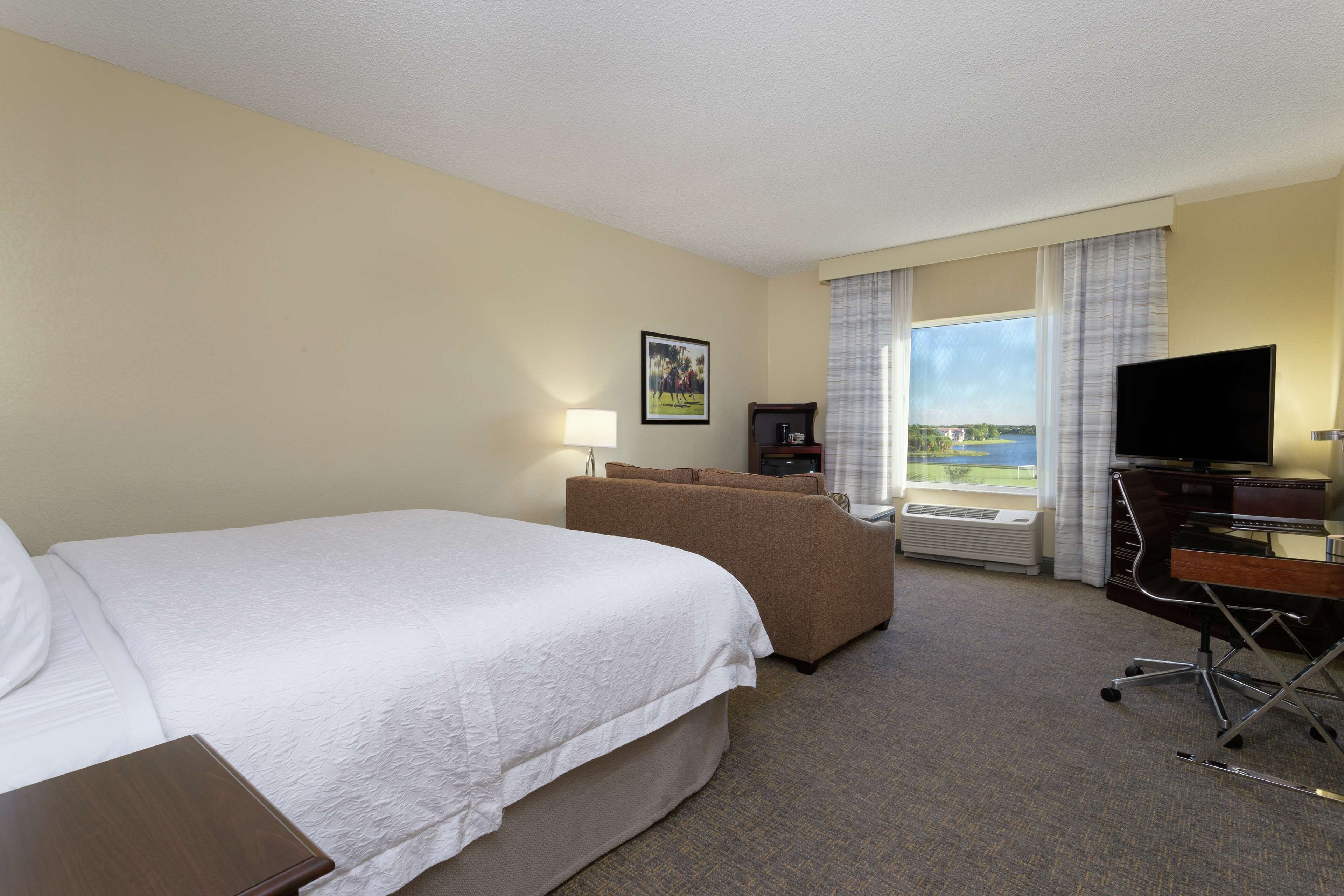 room, 1 king bed, refrigerator, lake view | premium bedding, desk, blackout curtains, iron/ironing board