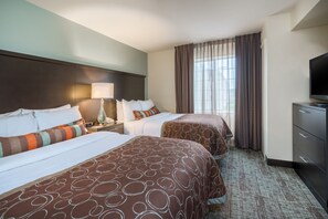 A hotel room with two beds, a TV, a lamp, and a large window with curtains. - Staybridge Suites Allentown West by IHG (Allentown)