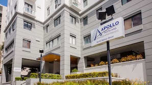 A multi-story building with a sign for Apollo Auckland Apartments on Nelson Street. - Quest On Nelson (Auckland)