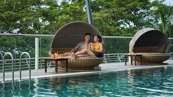 Outdoor pool, open 6:00 AM to 9:00 PM, pool umbrellas, pool loungers