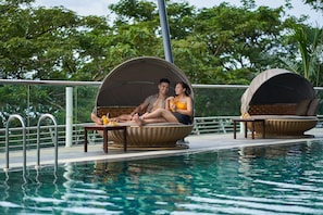 Outdoor pool, open 6:00 AM to 9:00 PM, pool umbrellas, pool loungers