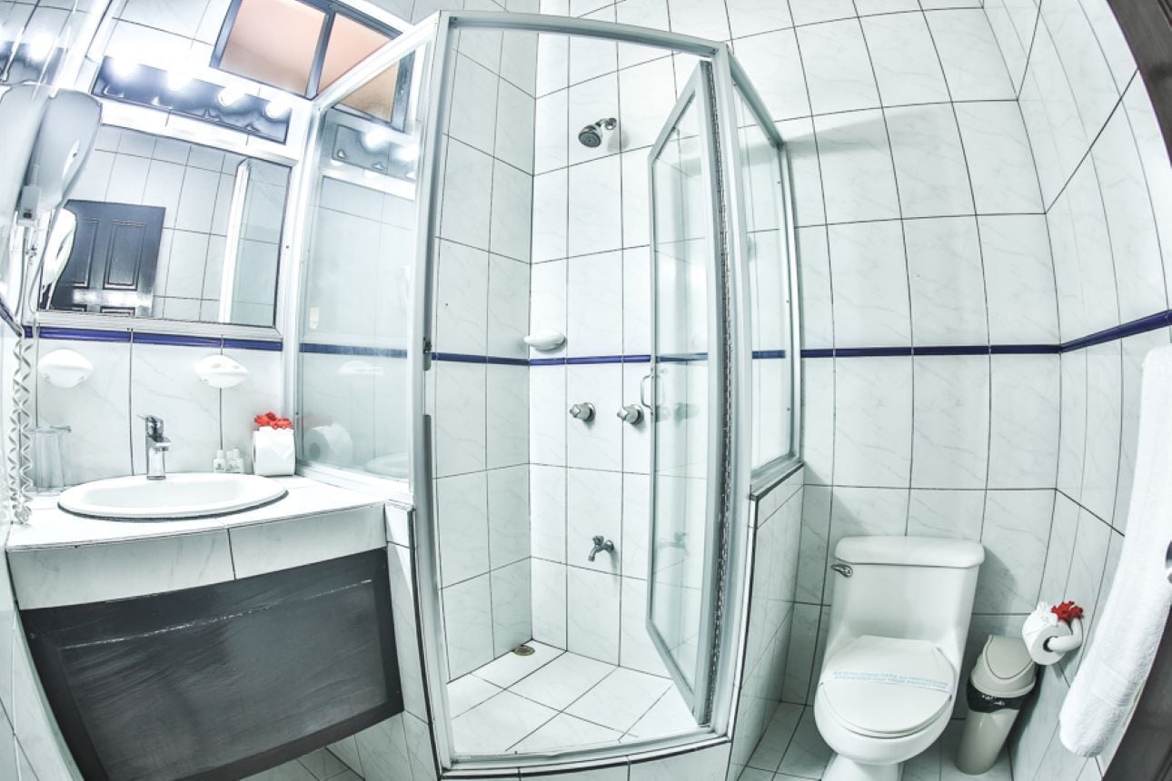 superior suite | bathroom | shower, free toiletries, hair dryer, towels