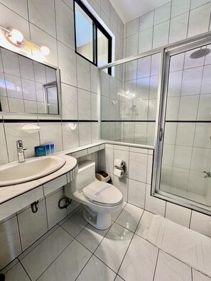 Deluxe Triple Room, 1 Bedroom, Balcony, Pool View | Bathroom | Shower, free toiletries, hair dryer, towels