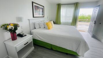 Premium bedding, desk, laptop workspace, iron/ironing board