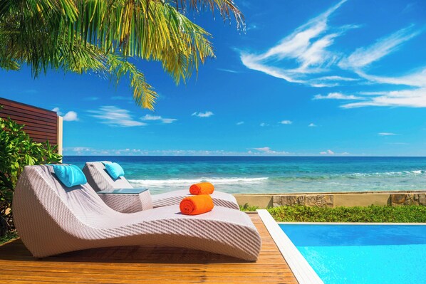 2 outdoor pools, open 8:00 AM to 6:00 PM, pool loungers