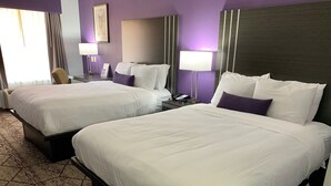 A hotel room with two beds, a desk, a chair, and a telephone. - SureStay Plus Hotel by Best Western Warner Robins AFB (Warner Robins)