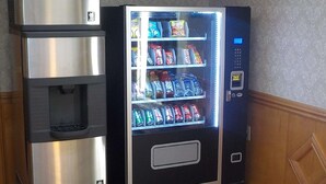 A vending machine with a water dispenser and a selection of beverages. - SureStay Plus Hotel by Best Western Warner Robins AFB (Warner Robins)