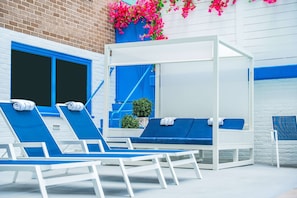 Seasonal outdoor pool, open 8:00 AM to 8:00 PM, pool umbrellas