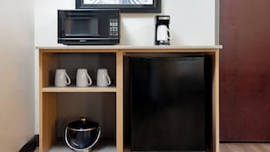 A kitchenette with a microwave, coffee maker, and a refrigerator. - Hyatt Place College Station (College Station)