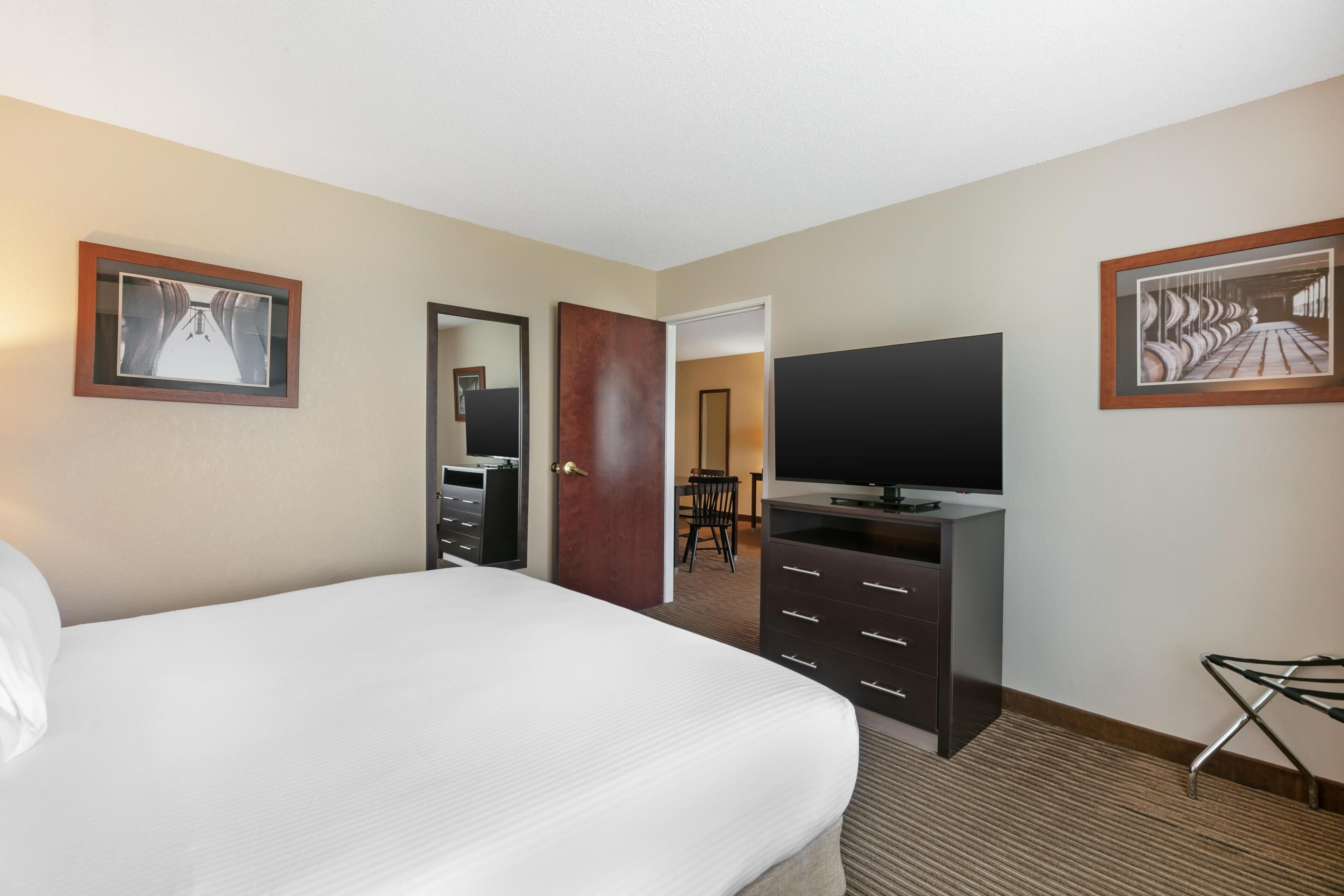 Hypo-allergenic bedding, desk, laptop workspace, blackout curtains