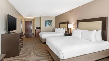 Hypo-allergenic bedding, desk, laptop workspace, blackout drapes