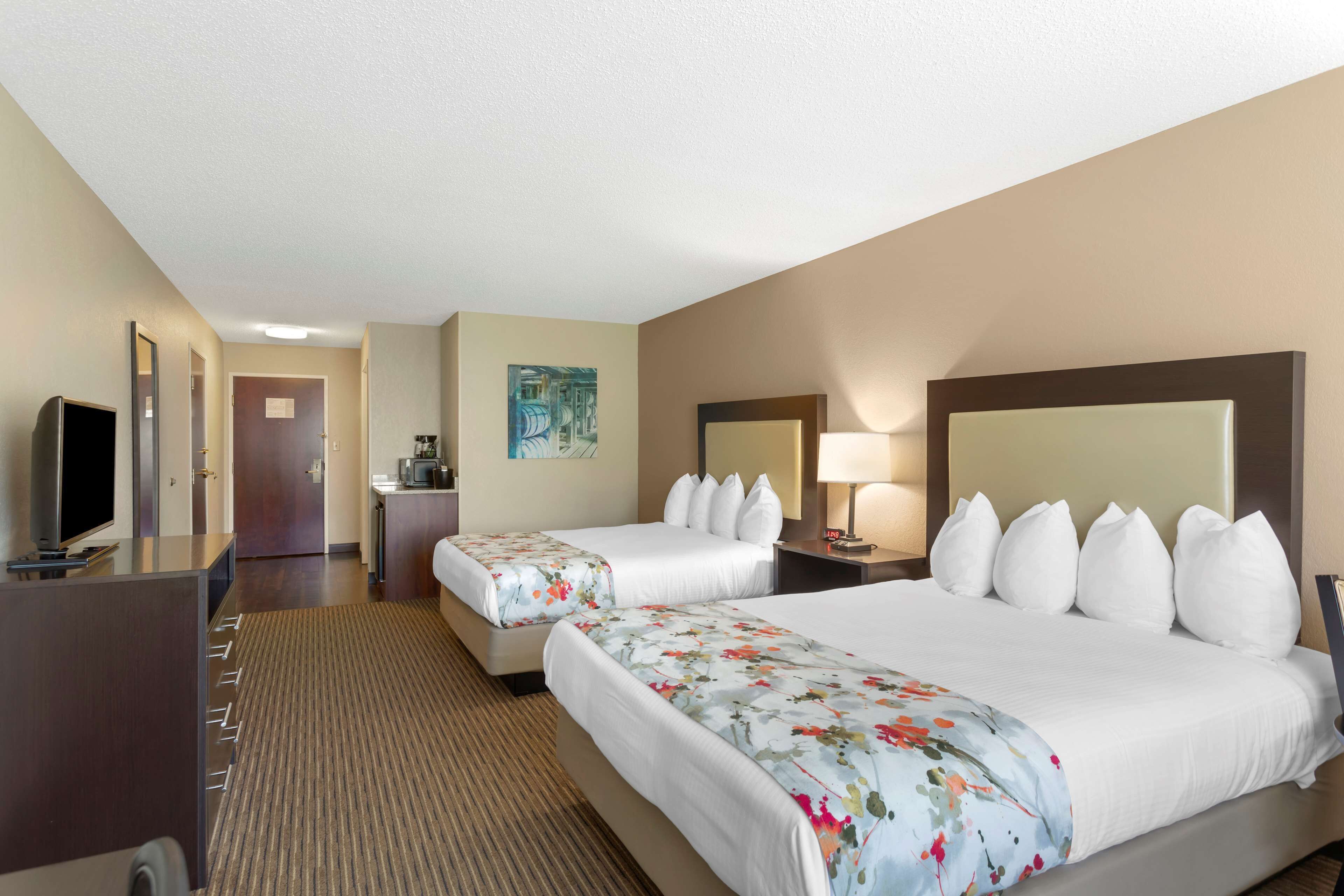 hypo-allergenic bedding, desk, laptop workspace, blackout curtains