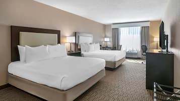 Hypo-allergenic bedding, desk, laptop workspace, blackout drapes