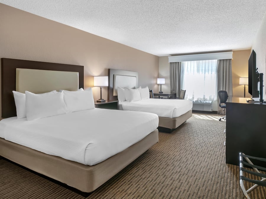 Hypo-allergenic bedding, desk, laptop workspace, blackout curtains