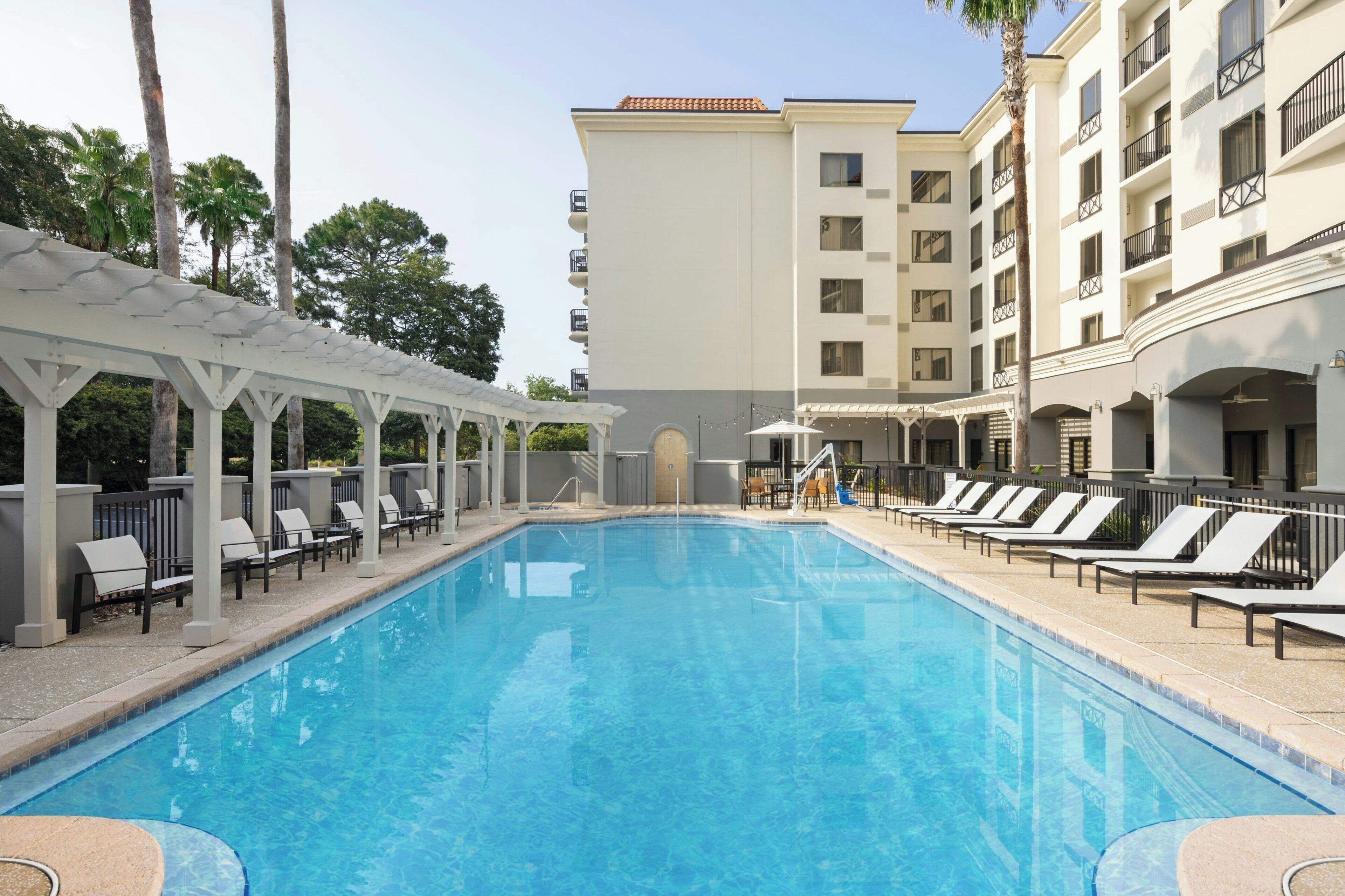outdoor pool, open 7:00 am to 10:00 pm, pool umbrellas, pool loungers