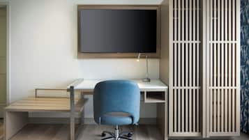 Premium bedding, desk, laptop workspace, blackout drapes