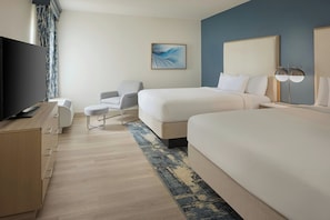 Premium bedding, desk, laptop workspace, blackout drapes