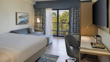 Premium bedding, desk, laptop workspace, blackout drapes