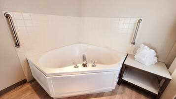 Suite, 1 King Bed, Non Smoking, Hot Tub | Bathroom | Combined shower/tub, hair dryer, towels, soap