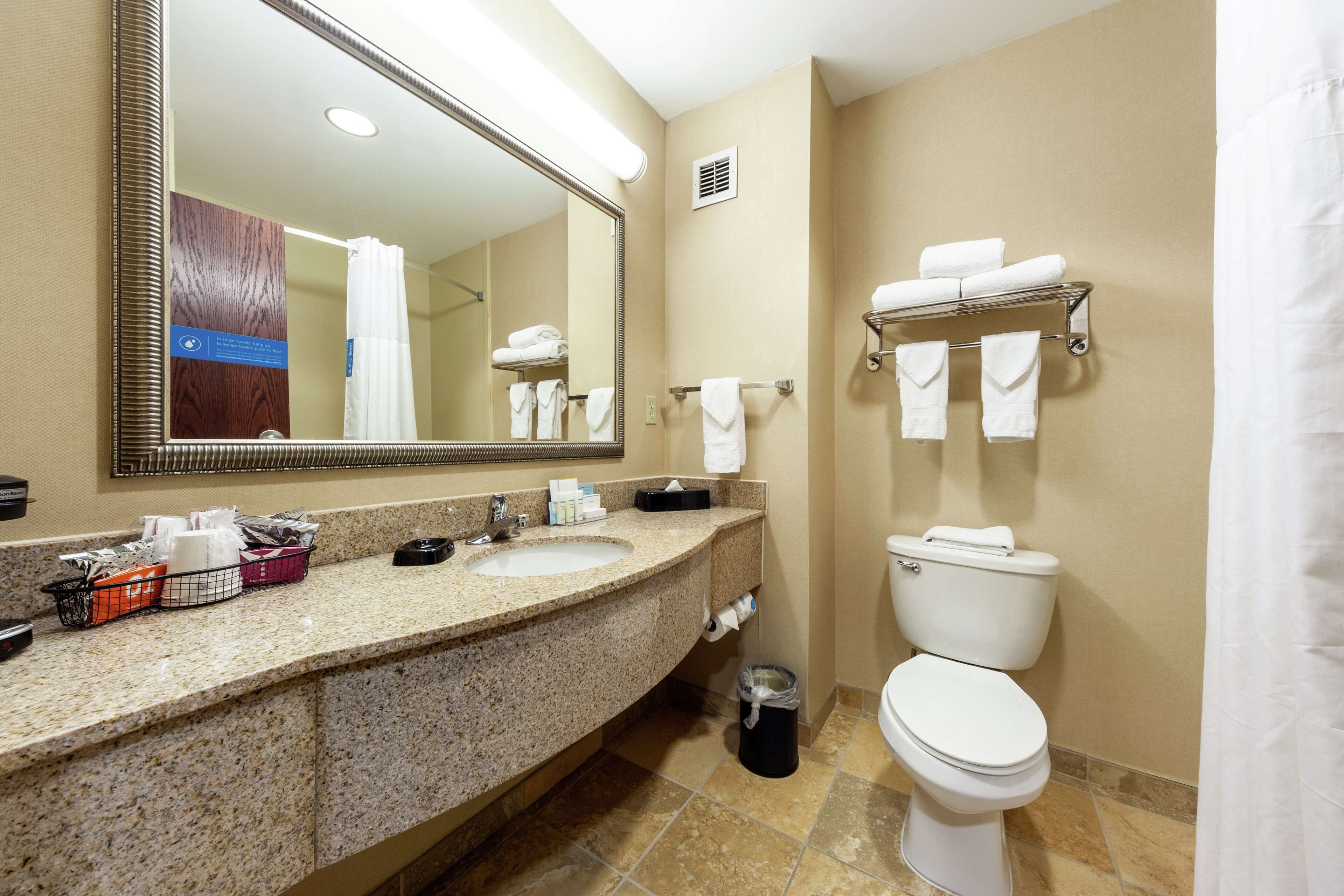 bathtub, free toiletries, hair dryer, towels