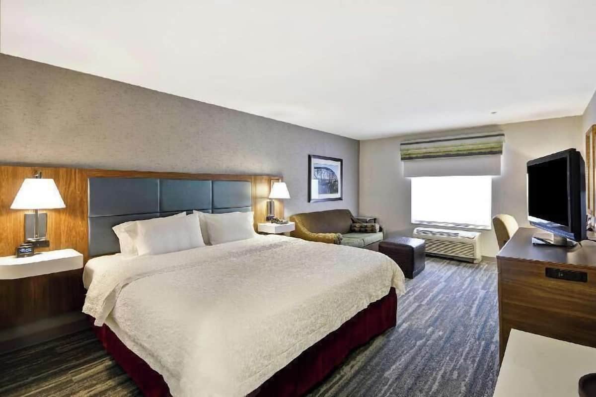 Premium bedding, desk, laptop workspace, blackout curtains