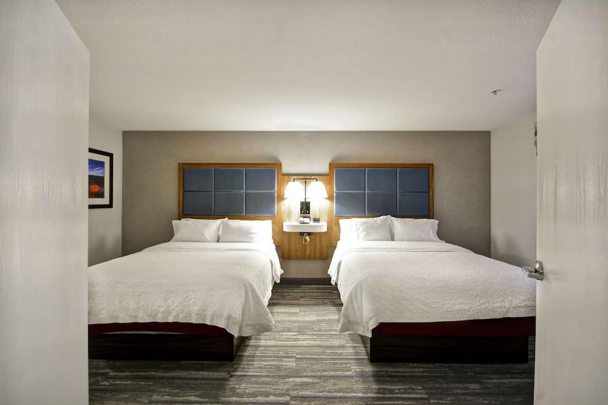 Premium bedding, desk, laptop workspace, blackout curtains