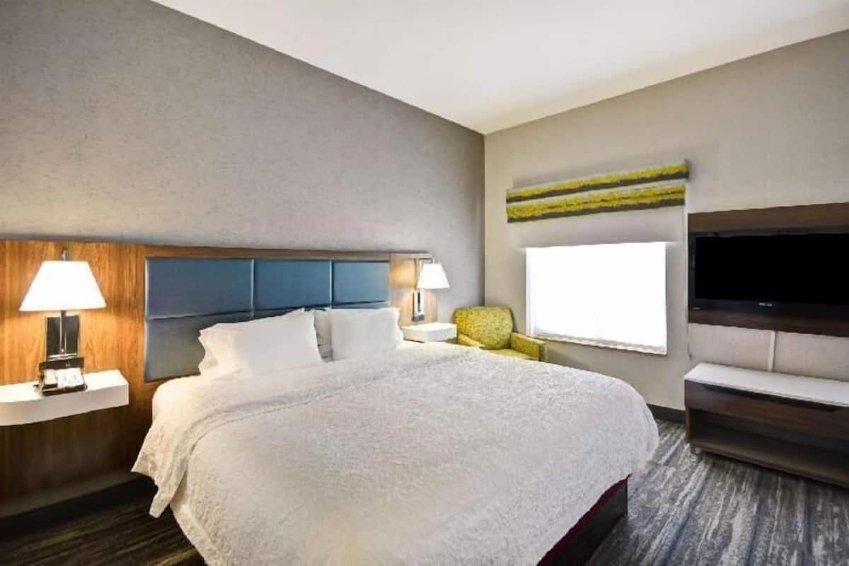 Premium bedding, desk, laptop workspace, blackout curtains