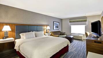 Premium bedding, desk, laptop workspace, blackout drapes