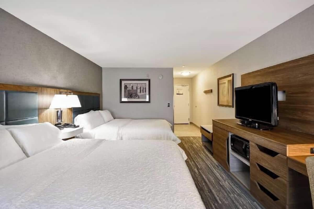 Premium bedding, desk, laptop workspace, blackout curtains