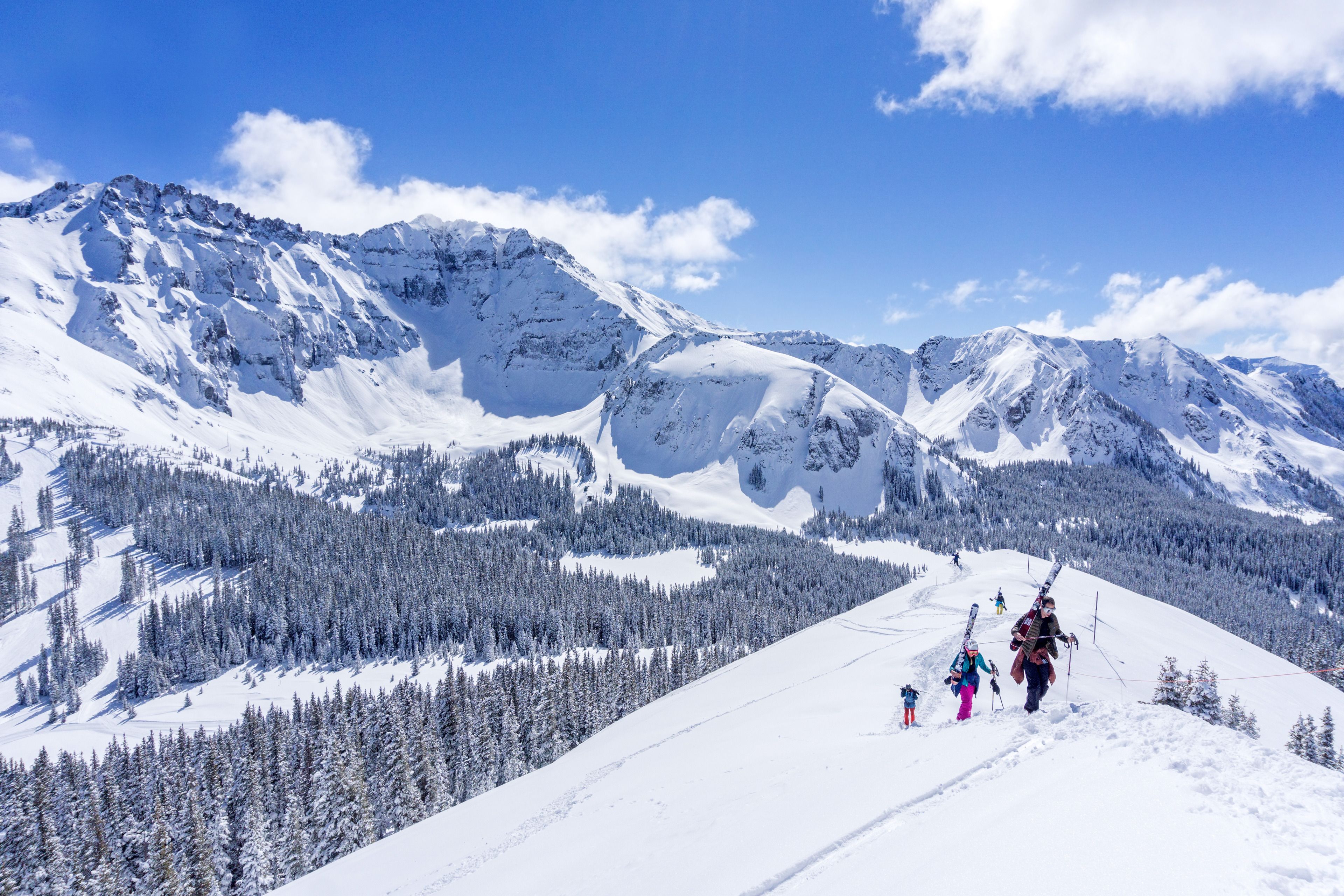 A snowy mountain landscape with a clear sky.