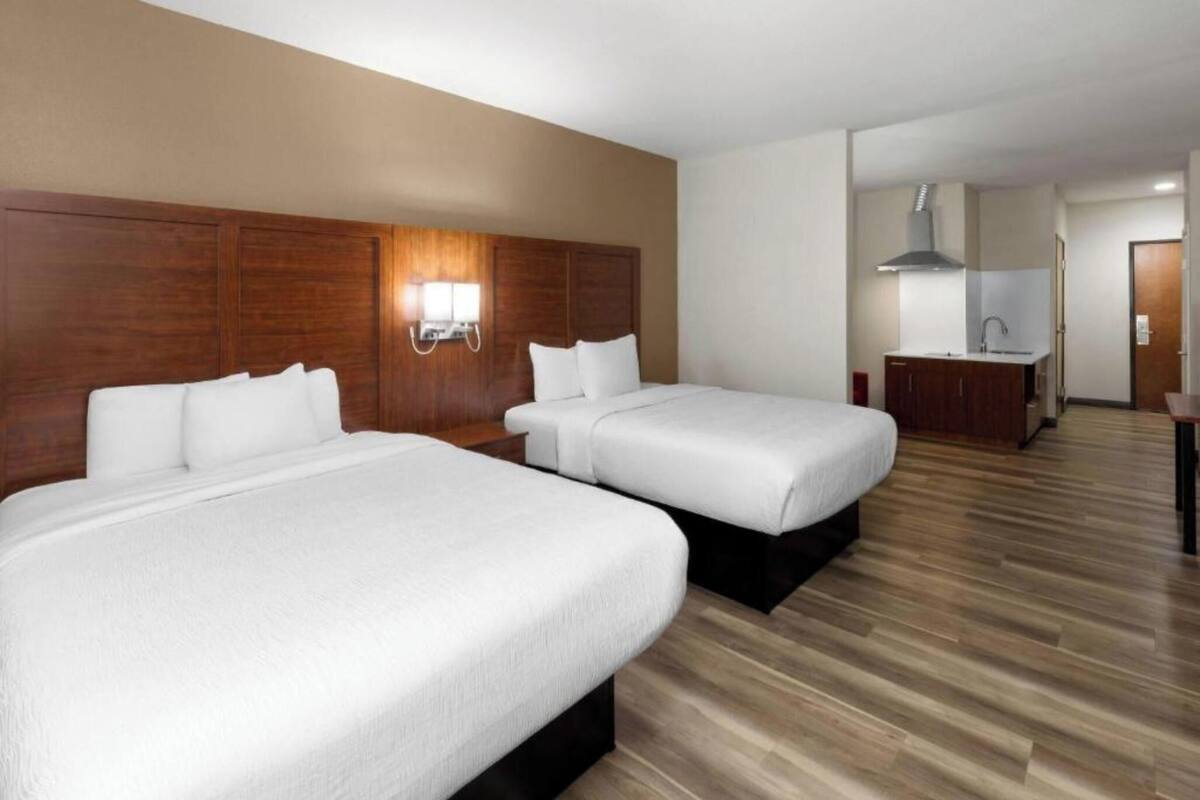 Pillowtop beds, desk, laptop workspace, blackout drapes