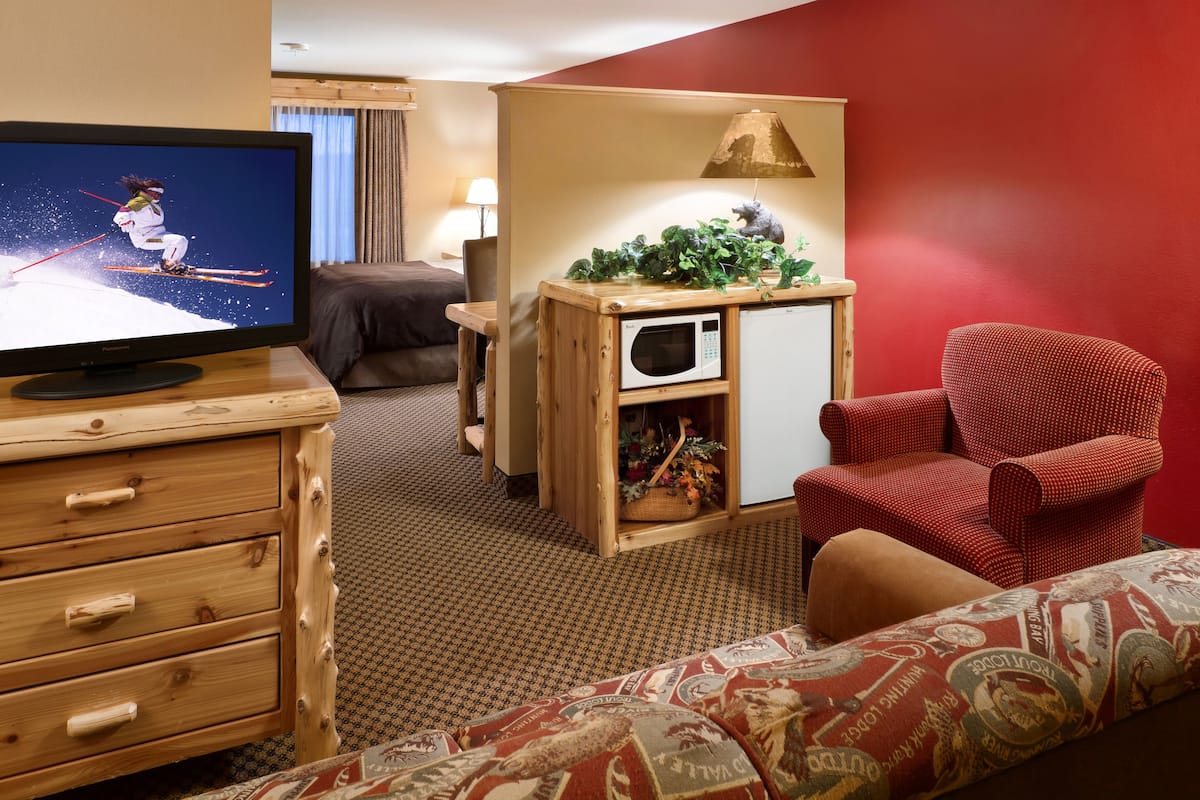 suite, 1 king bed with sofa bed | in-room safe, iron/ironing board, free cots/infant beds, rollaway beds