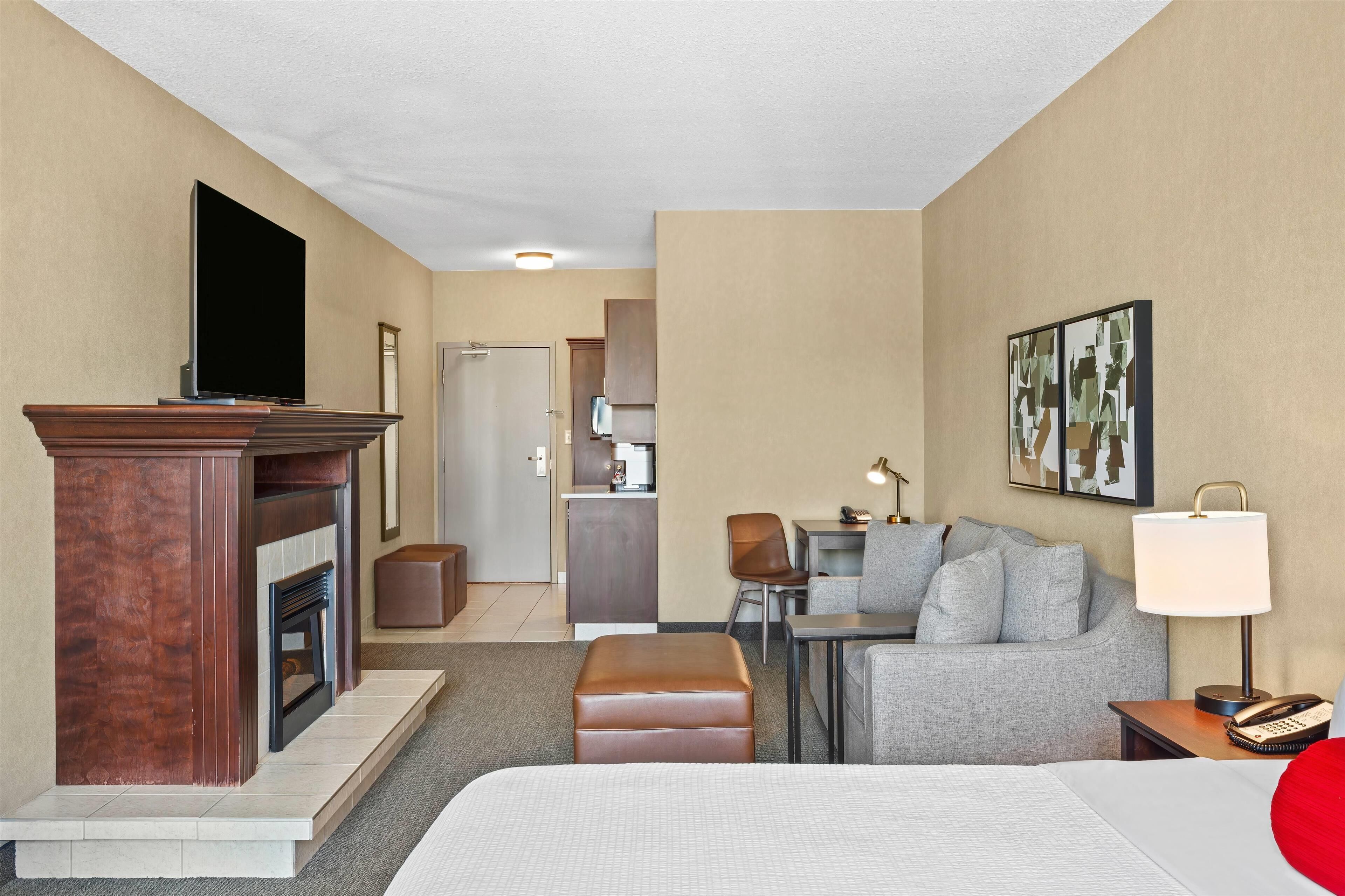 suite, 1 king bed with sofa bed, refrigerator & microwave (fireplace) | premium bedding, in-room safe, desk, blackout curtains