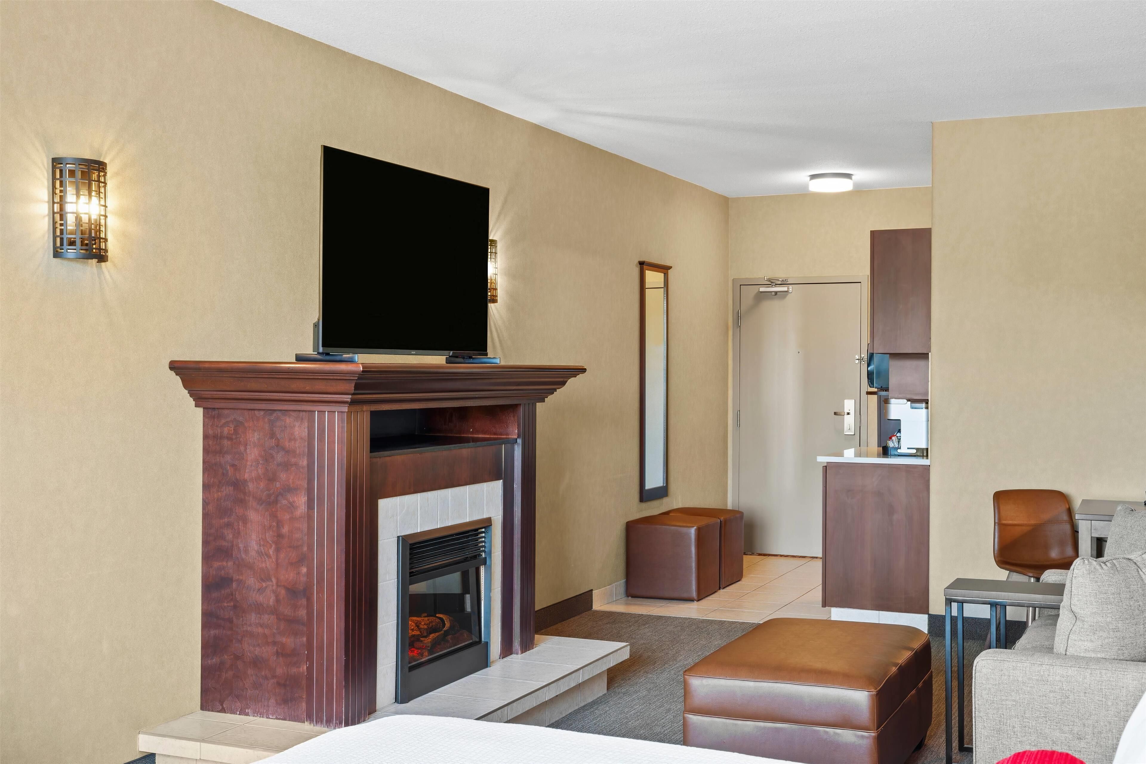 suite, 1 king bed with sofa bed, refrigerator & microwave (fireplace) | premium bedding, in-room safe, desk, blackout curtains