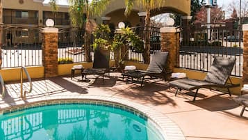 Outdoor pool, open 9:00 AM to 10:00 PM, pool umbrellas, pool loungers