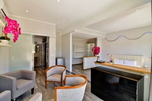 Junior Suite, Terrace, Pool View | Living room | Flat-screen TV