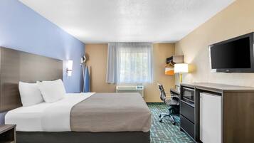 Suite, 1 King Bed, Non Smoking | Desk, laptop workspace, iron/ironing board, free cots/infant beds