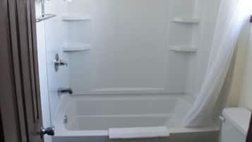 Combined shower/tub, towels, soap, shampoo