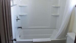 Combined shower/bathtub, towels, soap, shampoo
