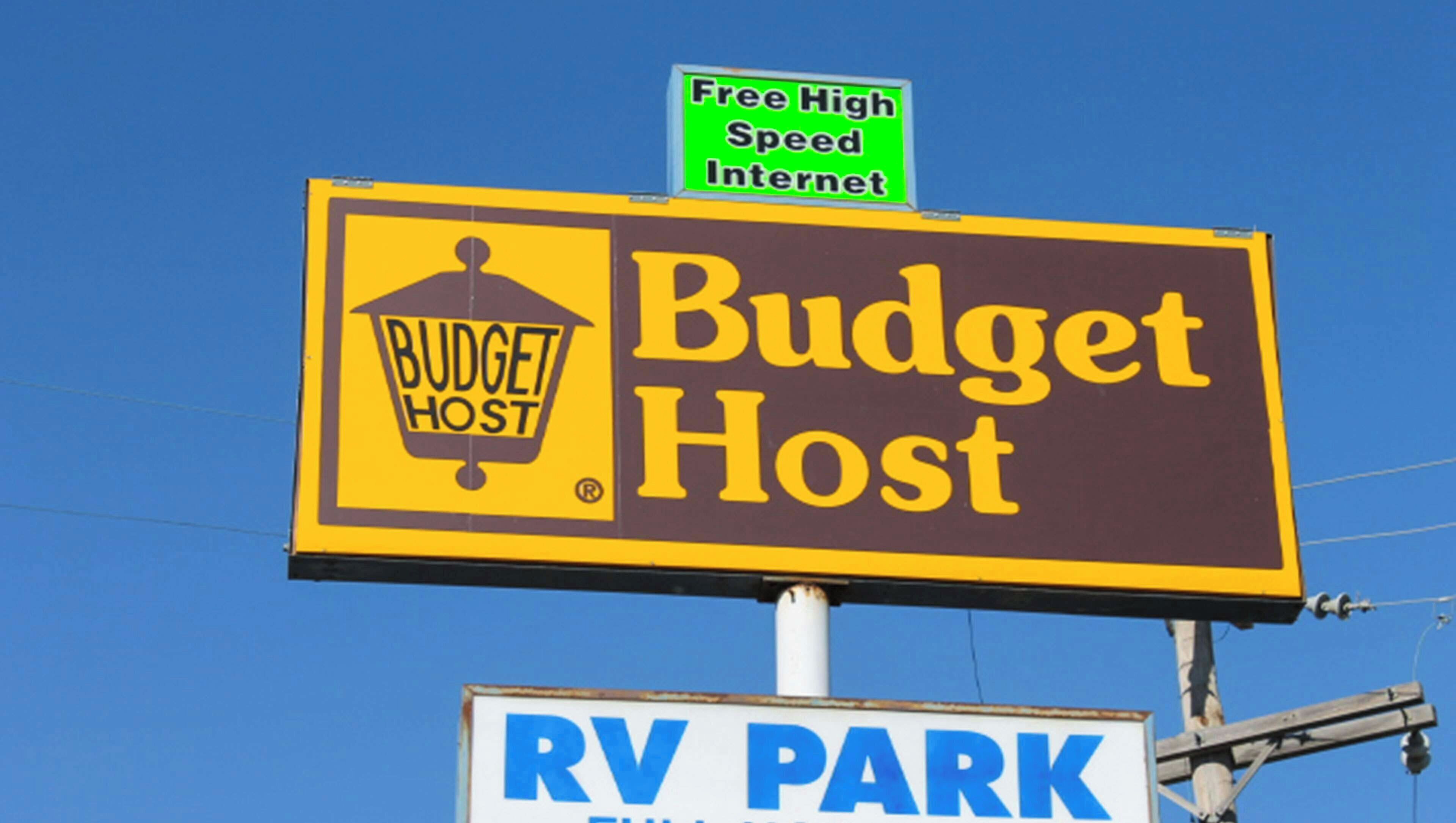 A billboard for Budget Host with a sign for Free High Speed Internet and an RV Park.