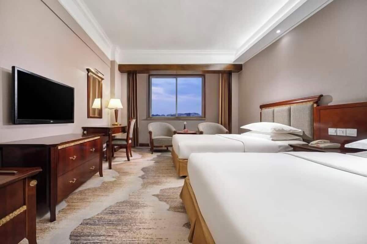 Luxe beddengoed, een minibar, een kluis op de kamer, een bureau