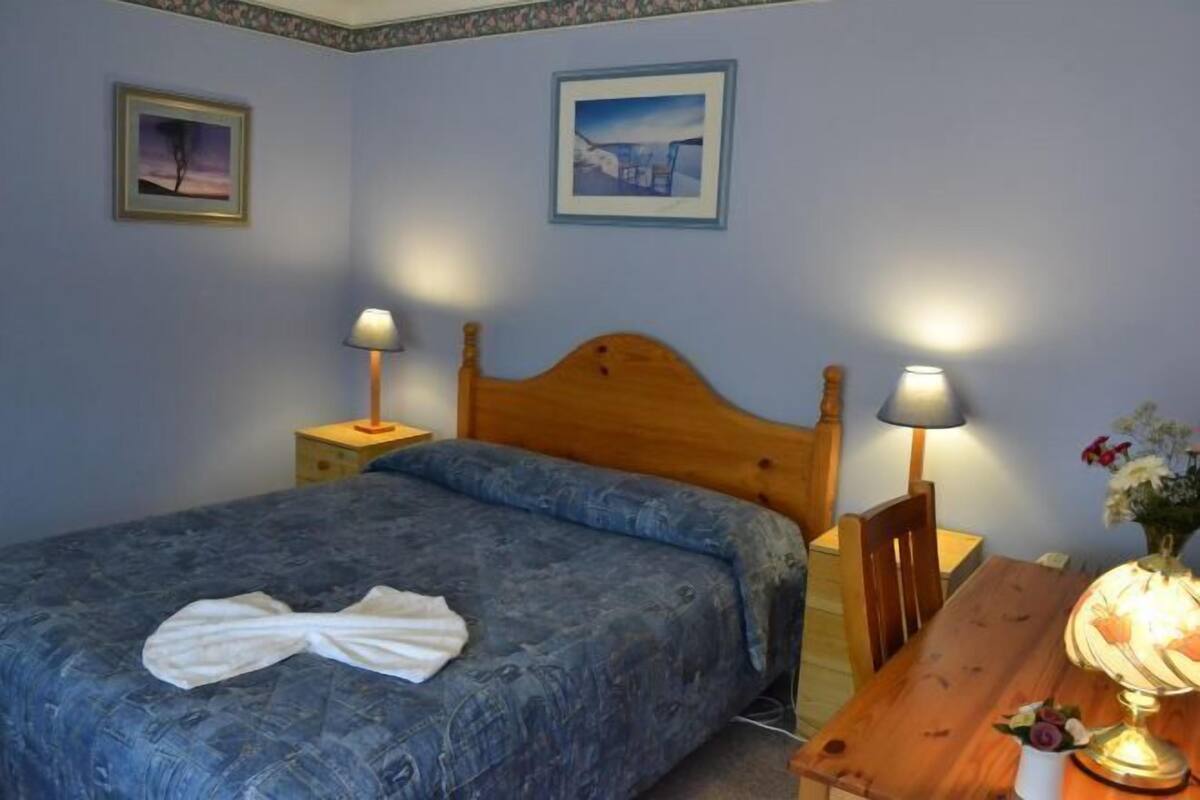 Select Comfort beds, desk, blackout drapes, iron/ironing board
