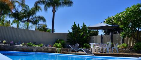 Outdoor pool, open 7:30 AM to 7:30 PM, pool umbrellas, pool loungers