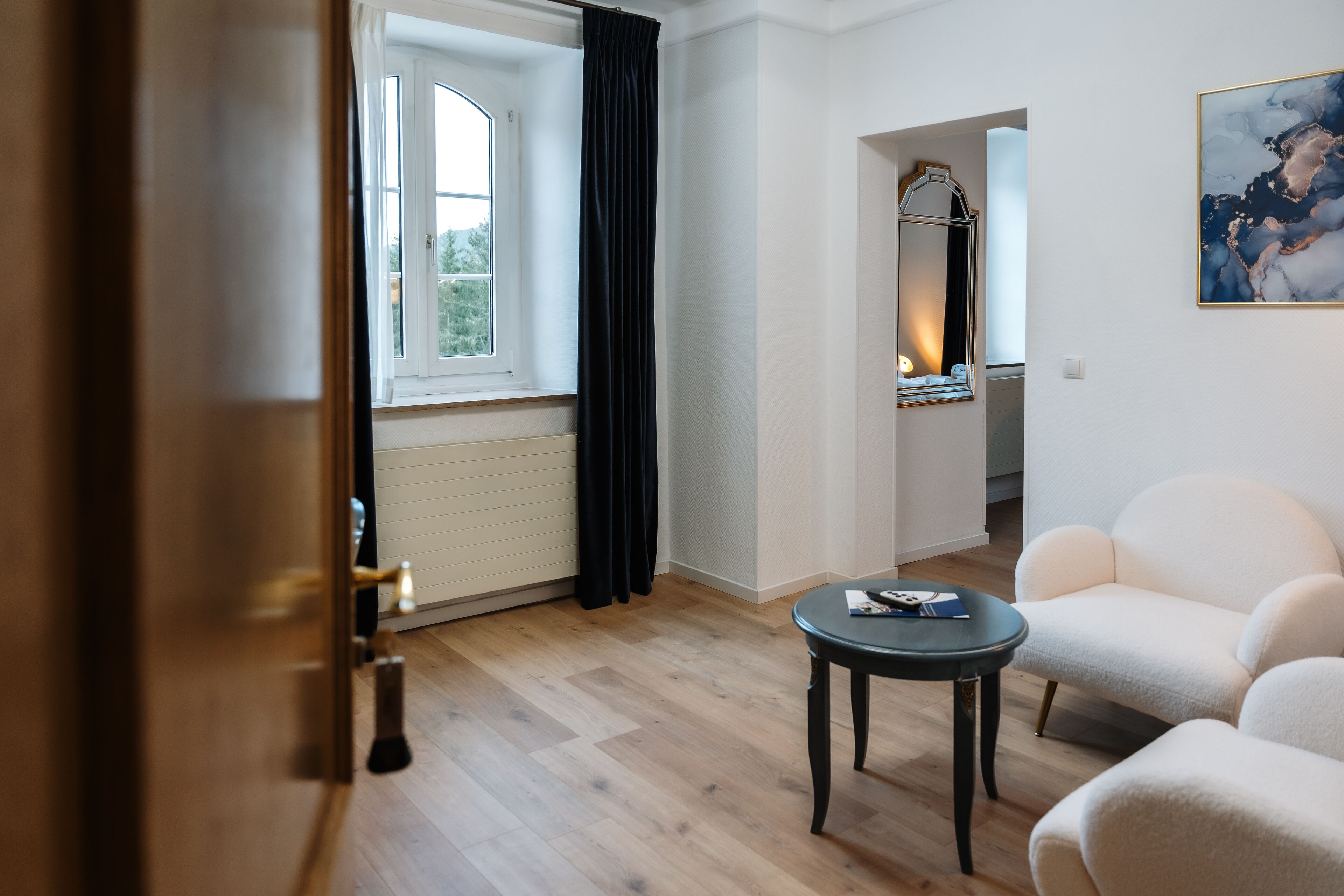 junior suite | living area | flat-screen tv