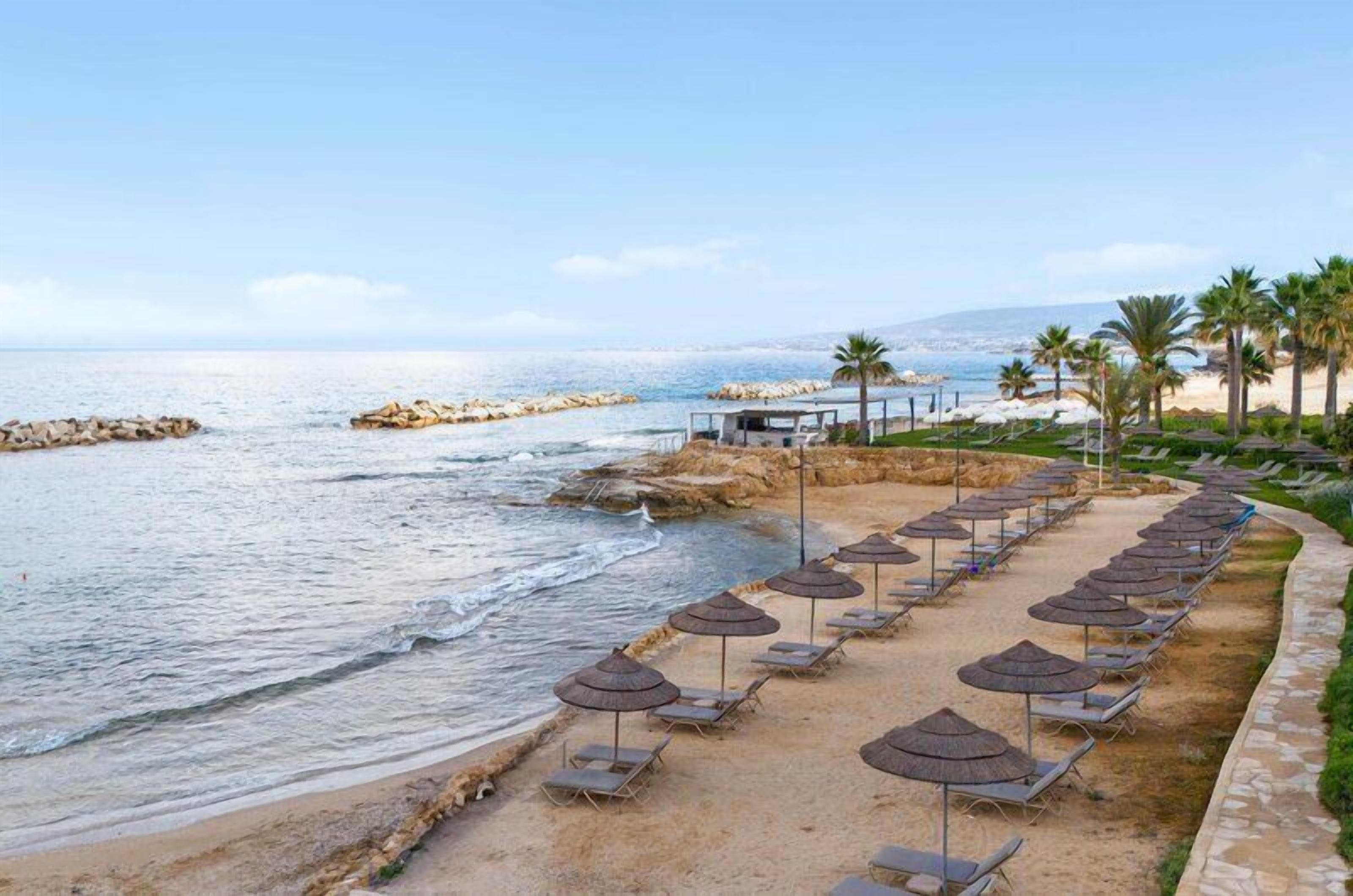 On the beach, sun loungers, beach umbrellas, beach towels