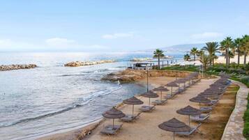 On the beach, sun loungers, beach umbrellas, beach towels