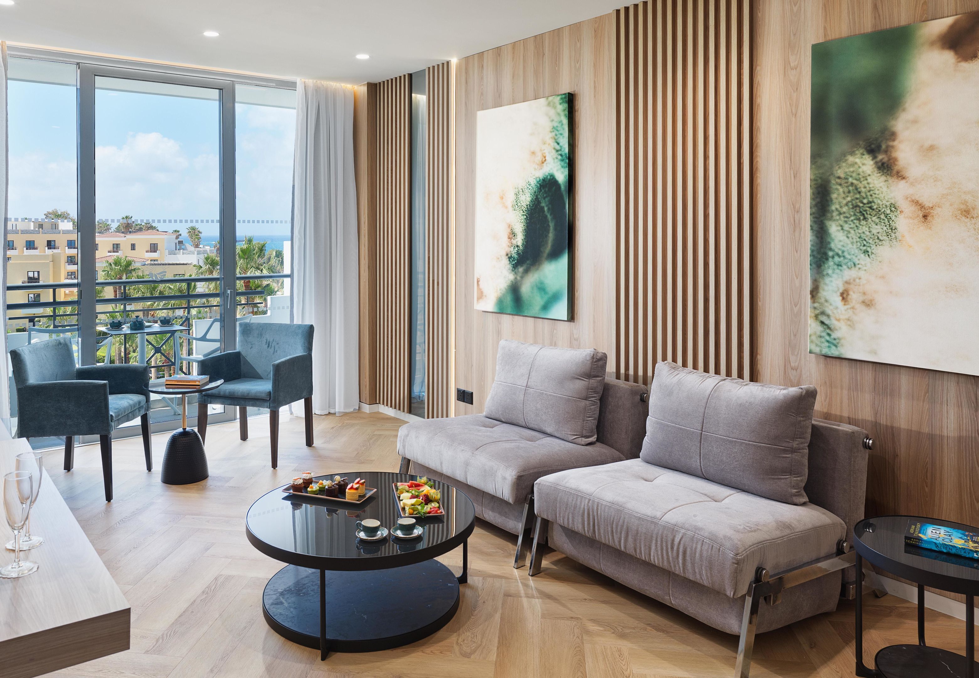 Deluxe Suite | Living area | 50-inch Smart TV with satellite channels, Netflix, streaming services