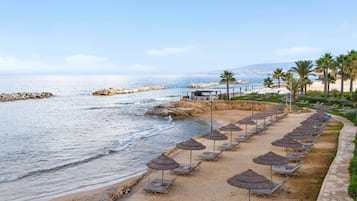 On the beach, sun loungers, beach umbrellas, beach towels