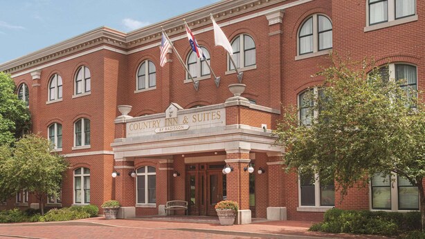 A brick building with a marquee reading "Country Inn & Suites by Radisson."