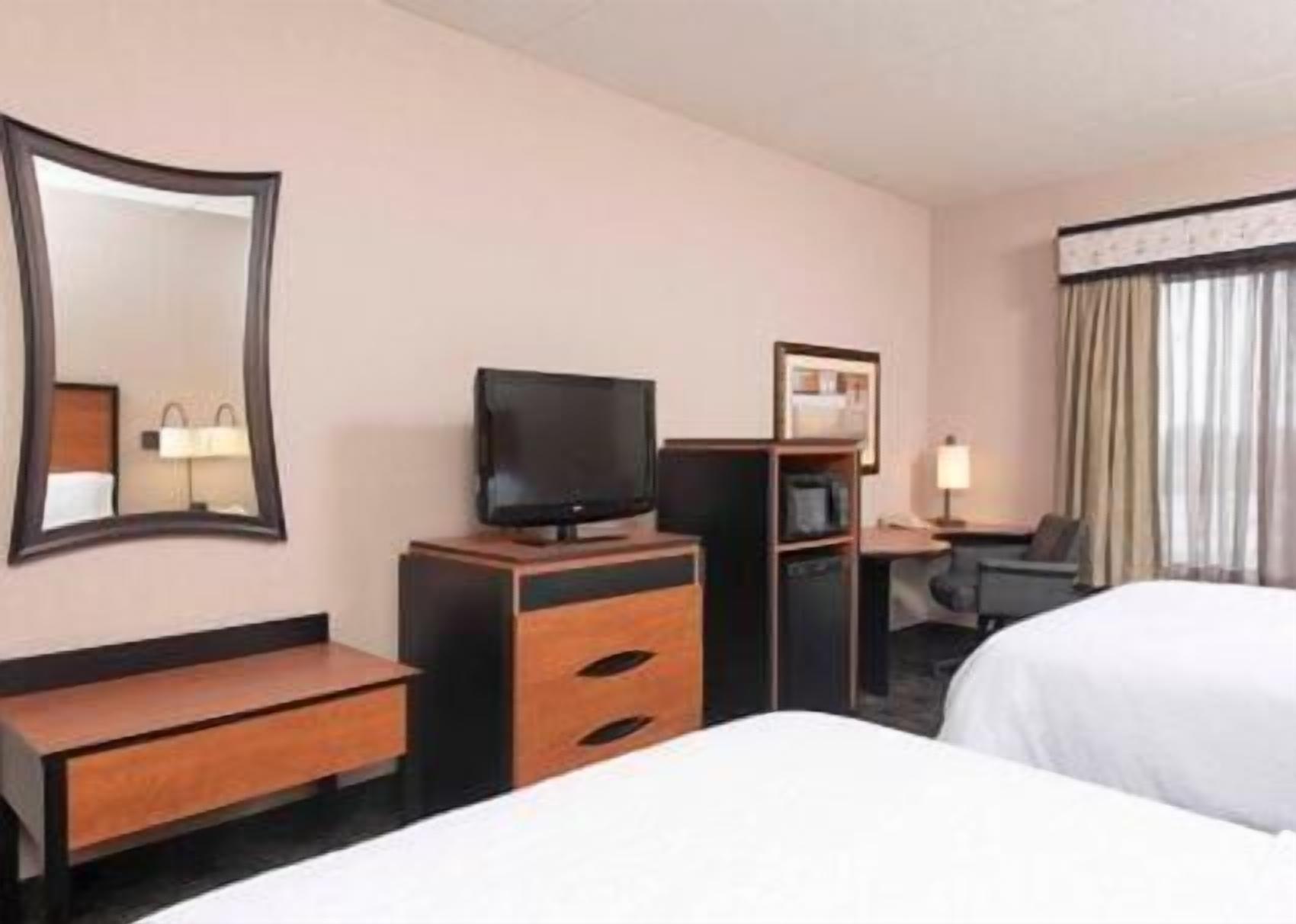 Desk, blackout drapes, iron/ironing board, free cribs/infant beds